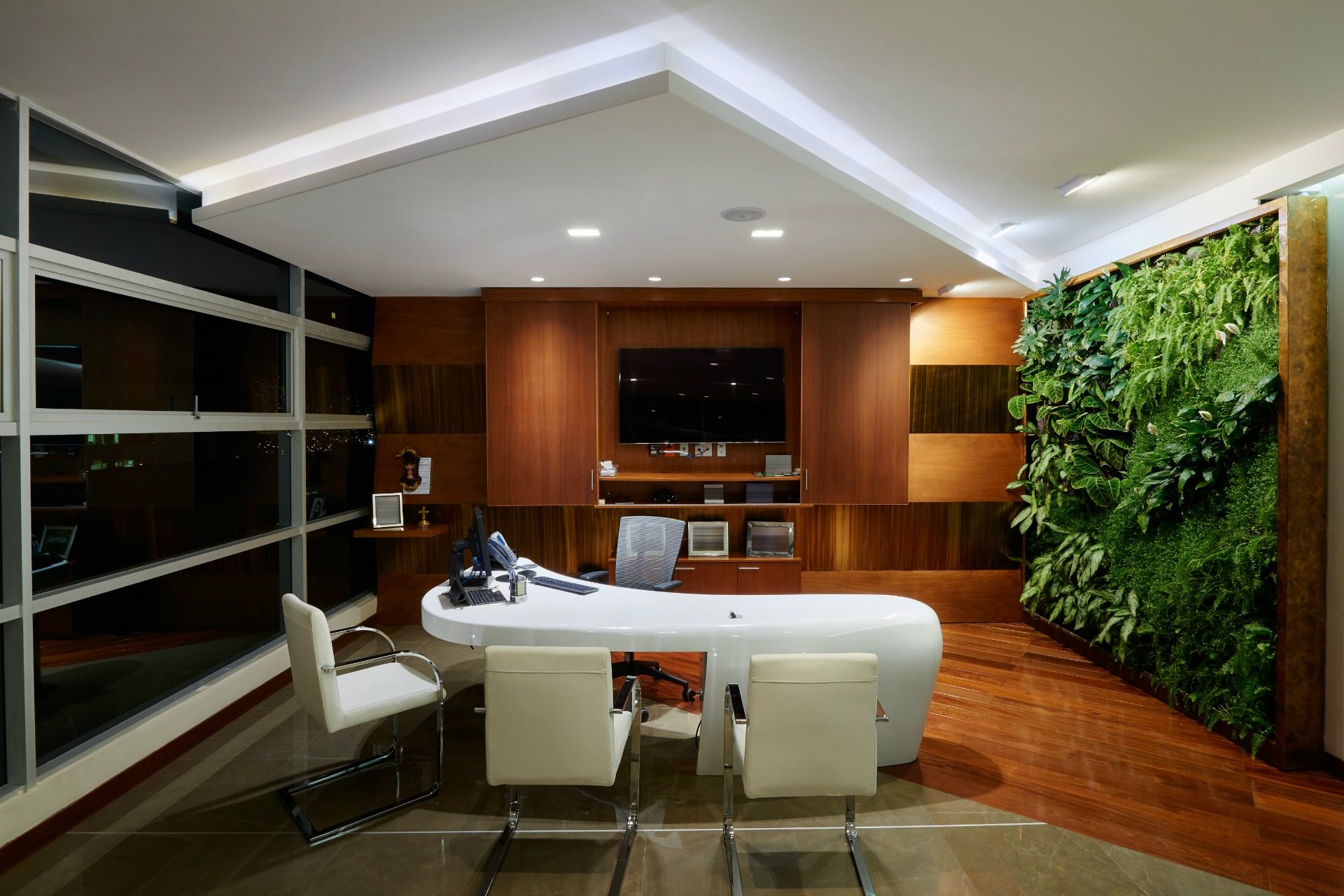 Corner office with wall of plants