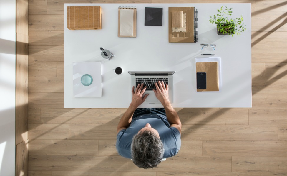 Overhead shot of man at desk working